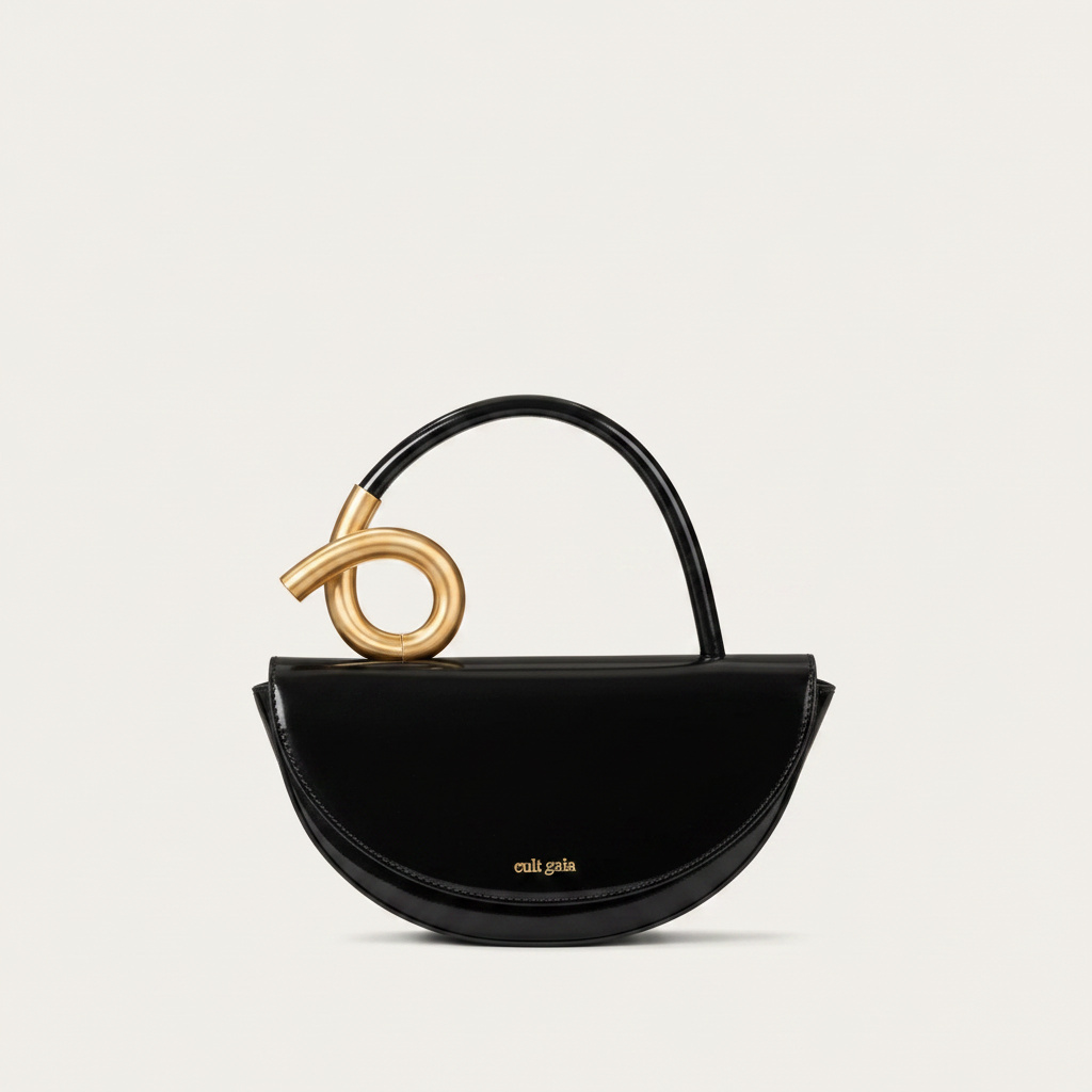 Black glossy leather top-handle handbag with gold twisted loop hardware