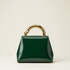 Forest green patent leather trapezoid handbag with gold swirl handle